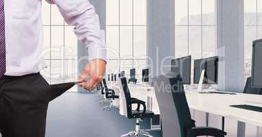 Cropped image of businessman standing in conference room with computers and chairs showing empty poc