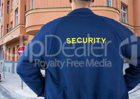 Rear view of security guard standing in city