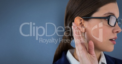 Businesswoman listening gossip against blue background