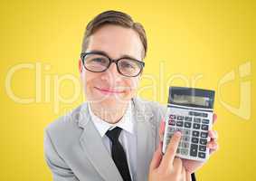 Man looking up with calculator against yellow background
