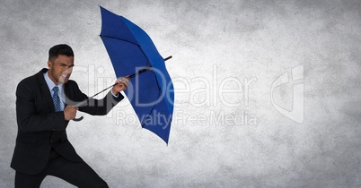 Business man blocking with umbrella against white background and grunge overlay