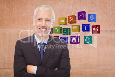 Business man with arms cross with icons on the back