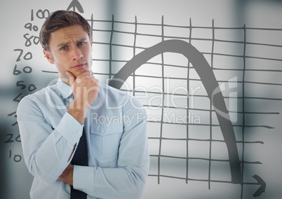 Business man thinking against graph doodle and blurry grey office