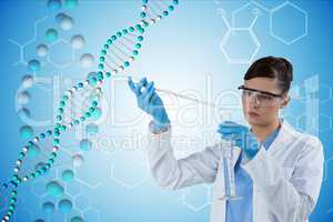 Woman doctor working with DNA graphics on background