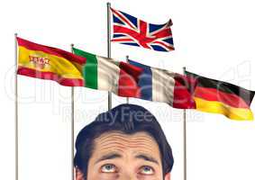 main language flags behind foreground  of young man