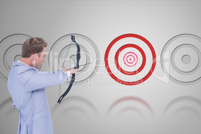 Archery player in front of grey background