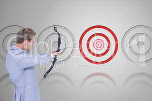 Archery player in front of grey background