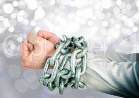 Hands in chains with sparkling light bokeh background