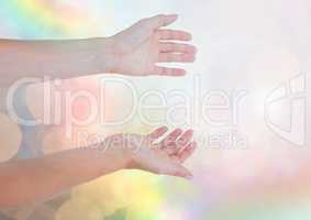 Hands open friendly with sparkling light bokeh background