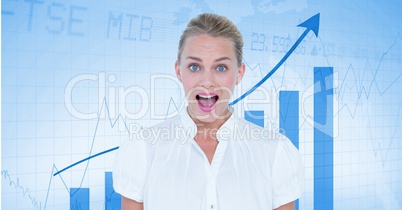 Happy businesswoman in front of a board with arrows and graphics