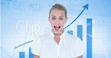 Happy businesswoman in front of a board with arrows and graphics