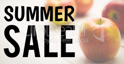 Black summer sale text against faded image of apples