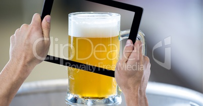 Hand taking picture of beer glass