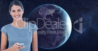 Digital composite image of smiling beautiful woman with cell phone in space standing against earth