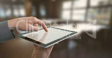 Businessman holding tablet in office