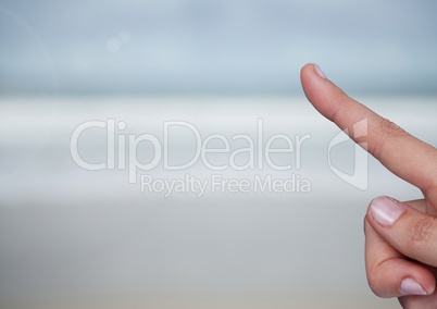 Hand touching air with sea horizon background
