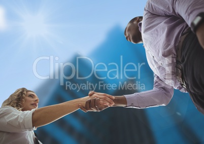 Business man and woman handshake . sky view. city.