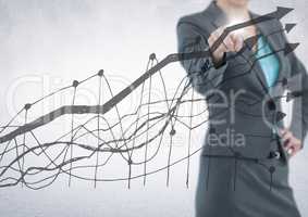 Business woman mid section pointing behind grey graph against white background and flare