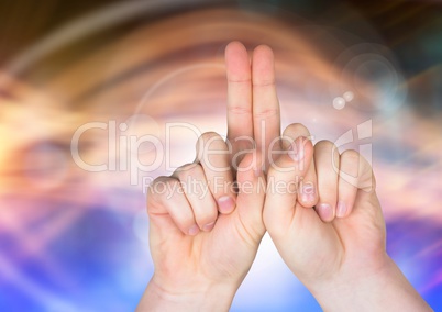 Hand and fingers together with sparkling light bokeh background