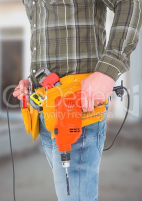 Carpenter with tools on building site