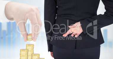Rear view of businesswoman with fingers crossed standing by 3d image of business hand arranging gold