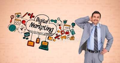 Businessman standing by digital marketing text and symbols against orange background