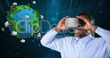 Businessman using VR glasses while looking at 3d image of planet earth