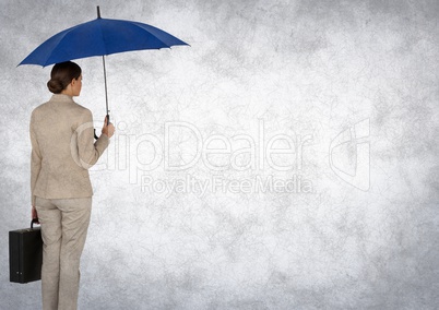 Back of business woman with umbrella and briefcase against white background and grunge overlay