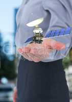 satellite solar panel on hand of a businesswoman in the city
