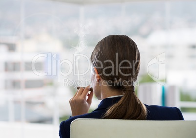 Businesswoman Back Sitting in Chair with cigar and buildings