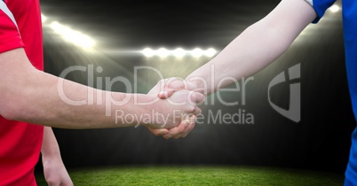 soccer player handshake in the field