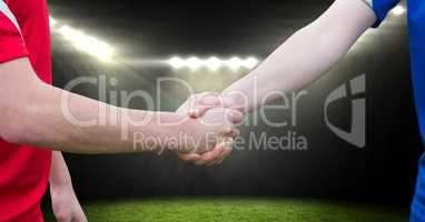 soccer player handshake in the field