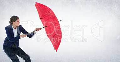Business woman with umbrella blocking rain against white background
