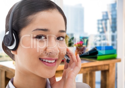 Customer service woman with headset in bright office