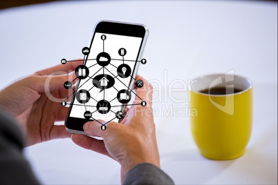 businessman is clicking on the screen of his smartphone against table background