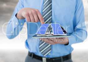 solar panel on hand of businessman