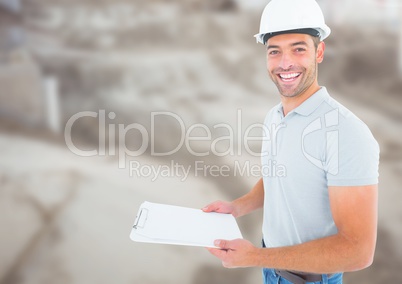 Construction Worker with chart in front of construction site