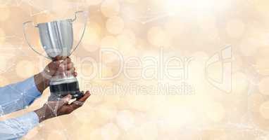 business hand with trophy, gold back