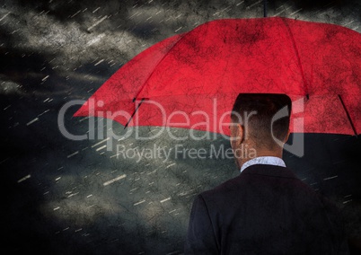 Back of business man with umbrella against rain and clouds with grunge overlay