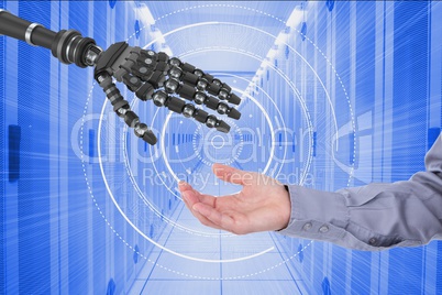 Human and robot touching their hands in blue digital background