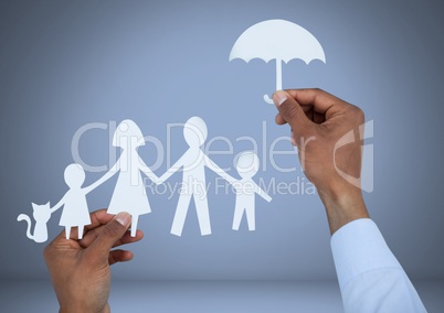 Cut out family and umbrella protection in hands