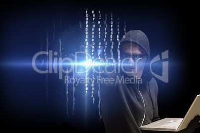 cyber criminal is holding a laptop against matrix code rain background