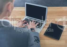 Businessman on laptop on desk