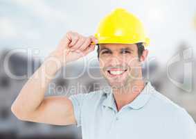 Construction Worker with safety helmet in front of construction site