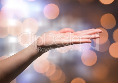 Hand open freely with sparkling light bokeh background