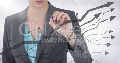 Business woman mid section with pen behind grey graph against white background and flare