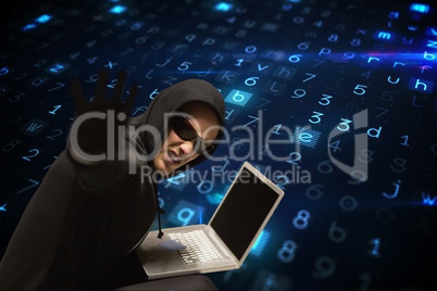 Cyber criminal wearing glasses is hacking from a laptop on matrix code rain background
