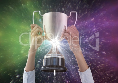 business hands with trophy, black background with pink and green flares