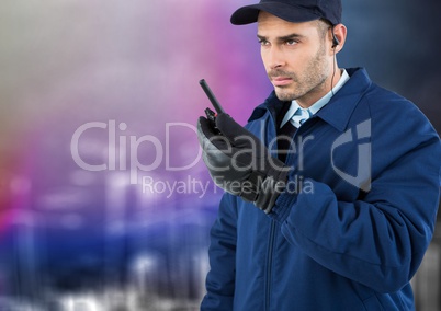 Security guard with walkie talkie against blurry wall with city sketch