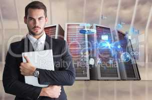Businessman holding a laptop against database background